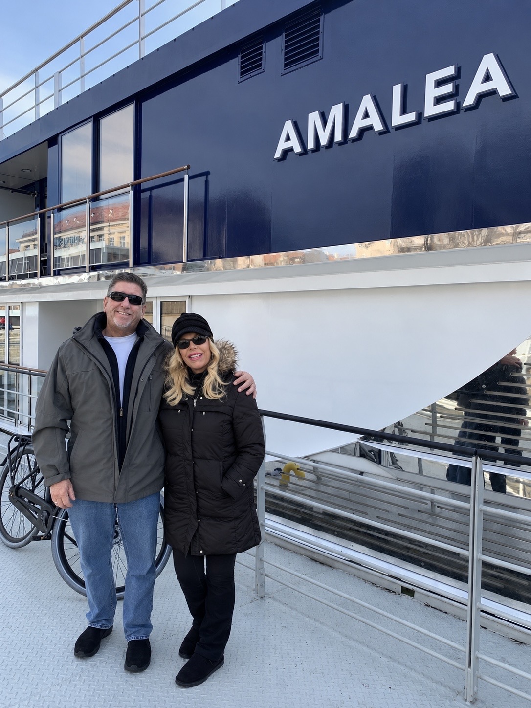 Laura North and her husband in front of the AmaWaterways ship Amalea.